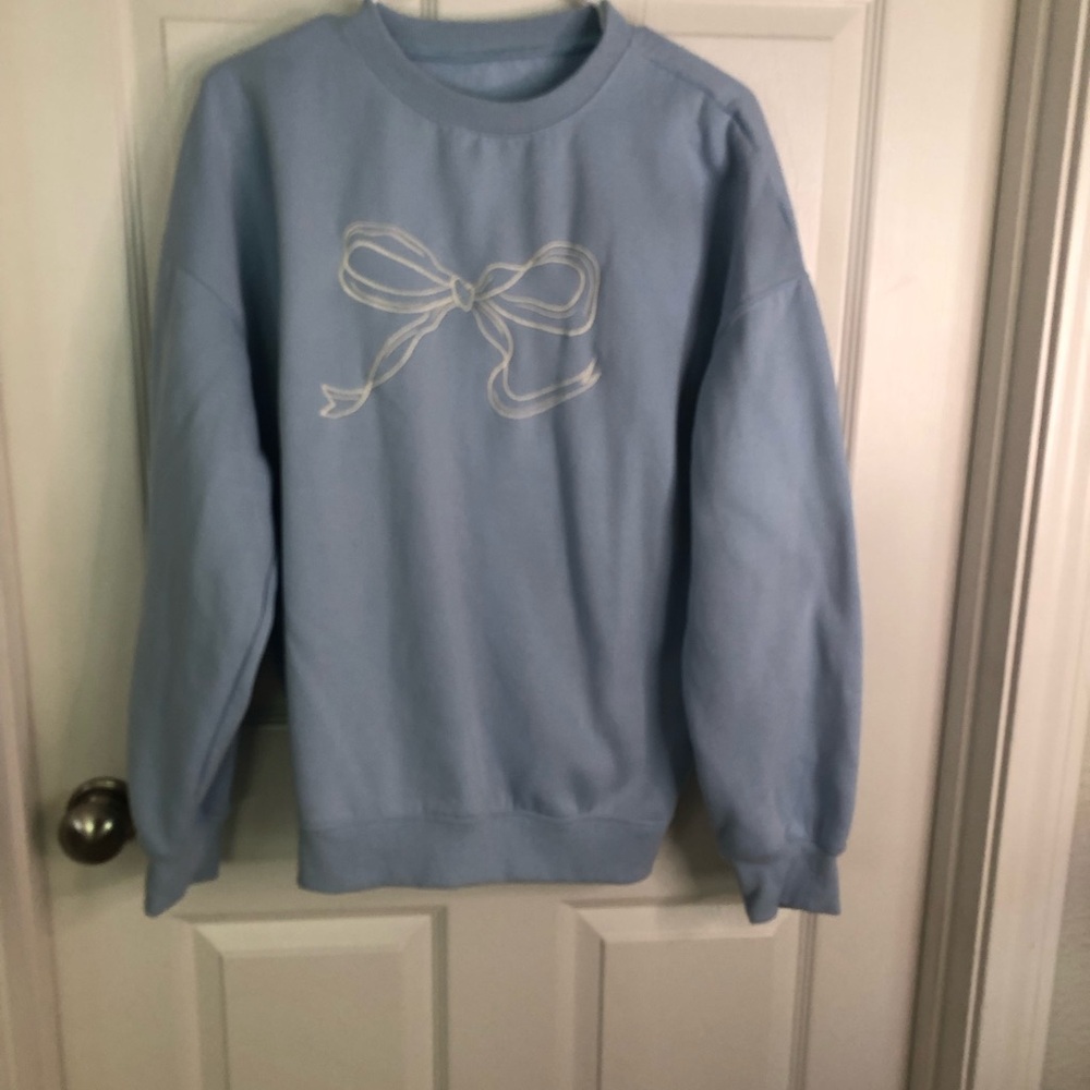 Amazon Light Blue Crewneck Sweatshirt with White Bow Graphic
